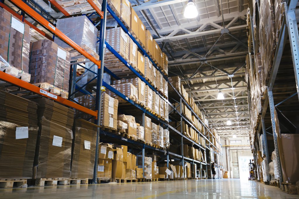 An image of stack shelves in a large warehouse that Trak360 software could help manage.